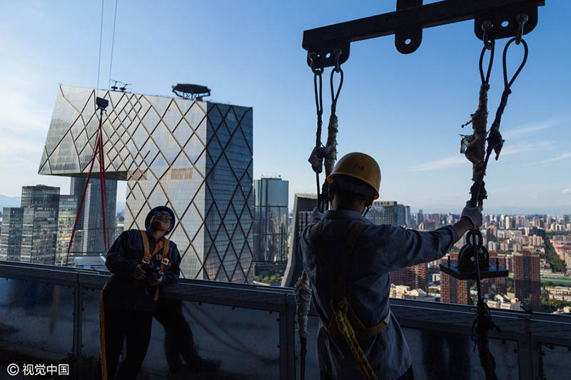 Os rostos por trás do edifício mais alto de Beijing