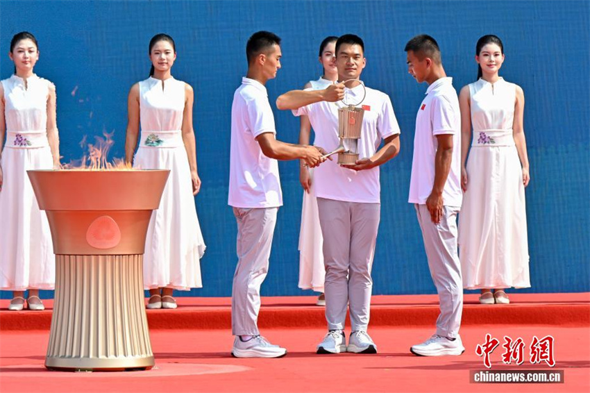 15ª edição dos Jogos Nacionais e Jogos Olímpicos Especiais para Deficientes: cerimônia de atear da chama realizada em Guangzhou