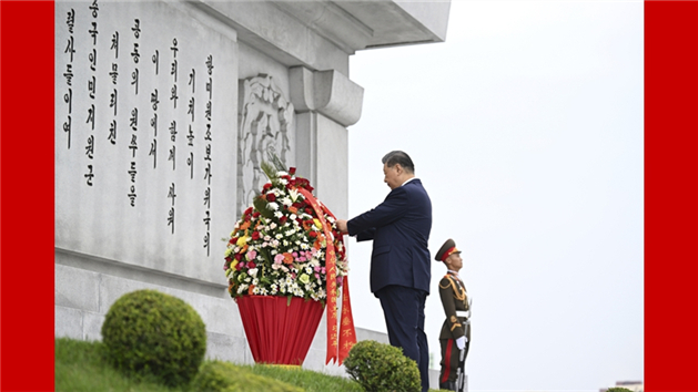 Xi e Kim comprometem-se a levar adiante a grande amizade tradicional China-RPDC através de gerações